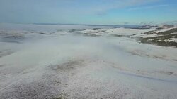 Fog above winter landscape under the blue sky Stock Footage