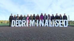 Pro choice campaigners holding "decriminalised" display News Clip