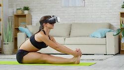 Woman in VR Glasses Stretching on Mat Stock Footage