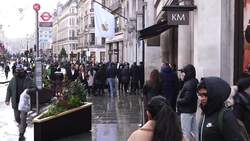 Shoppers queue for the Apple Store on Regent Street News Clip
