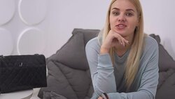 Beautiful girl sits in a chair Stock Footage