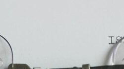 Footage of the word ISLAMOPHOBIA appearing from the right side on a sheet of paper Stock Footage