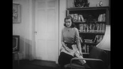 1950s: Husband sits at dinner table and speaks Stock Footage