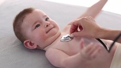 Little baby boy is examined by a doctor. Stock Footage