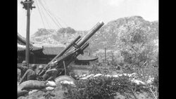 Korean War: artillery weapon fires during retreat of US and Greek forces News Clip