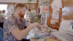 Creative designer reviewing photographs in office Stock Footage