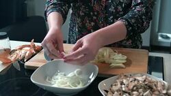 Woman preparing onion Stock Footage