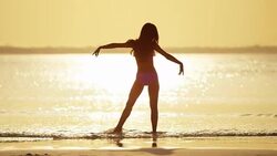 Young African American Asian Chinese girls on beach Stock Footage