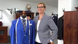 in a taylor shop a female taylor is looking into the camera Stock Footage