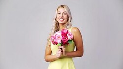 happy young woman with flowers Stock Footage