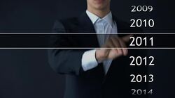 Businessman selects 2015 year in virtual menu, search for data, business history Stock Footage