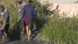 CLEAN : Migrants cross Rio Grande from Mexico into US as entry ban extended News Clip