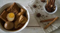 hard-boiled egg in brown sauce or sweet gravy sauce with tofu Stock Footage
