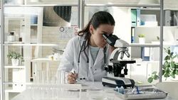 Young Woman Conducting Research in Laboratory Stock Footage
