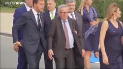 Juncker seen stumbling before NATO gala dinner, leaders step in to help News Clip