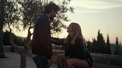 Happy couple on vacations. Old town panorama in background Stock Footage