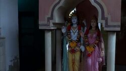 MEDIUM ANGLE OF TWO FIGURES OR STATUES, ONE MAN, ONE WOMAN, COULD BE HINDU GODS. RELIGIOUS. Stock Footage