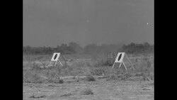 Pilots in US Army warplanes firing machine guns at targets on ground and on water near Miami News Clip