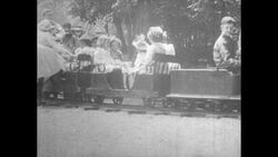 United States, 1930s-1940s: factory workers lower a steel car exterior onto a car frame and engine Stock Footage