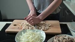 Woman cutting chicken meat Stock Footage