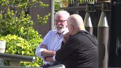 Gerry Adams speaks with Christy Moore outside Dublin's High Court News Clip