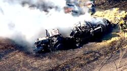 Aerials of emergency services at the scene of a tractor fire News Clip