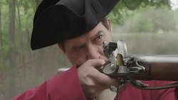 Revolutionary War soldier firing musket Stock Footage
