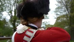Men dressed as Revolutionary War soldiers fire muskets Stock Footage