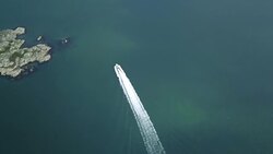 Drone shot of boat going through the Swedish archipelago Stock Footage