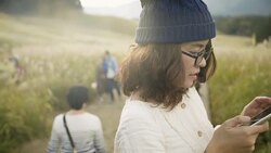 Asian tourist woman taking pictures of the mountainside with her camera at Stock Footage
