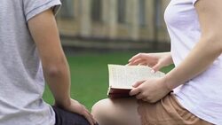 Couple in love holding hands on campus, sincere feelings, precious time together Stock Footage