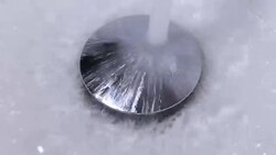 Closeup of tap water flowing into stainless steel drain Stock Footage