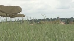 Crowds watching D-Day anniversary parachute drop News Clip