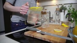 Young woman pouring lemonade Stock Footage