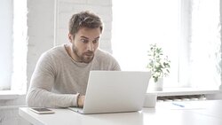 Beard Man in Shock while Working on Laptop, Astonished Stock Footage