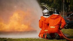 Firefighters fighting a fire operation, Water spray by high pressure nozzle to fire surround with smoke, Firefighters extinguish a car Stock Footage