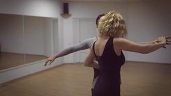 Man and a woman are dancing in the studio Stock Footage
