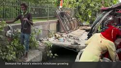 Battery-powered rickshaws spark electric vehicle revolution on India's streets News Clip