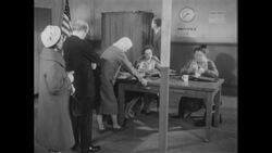 1960s: Woman and man in living room looking bored and apathetic Stock Footage