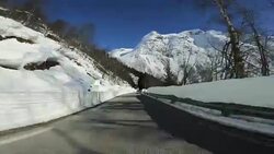 POV car driving in snow: mountain pass in Norway Stock Footage