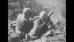 During Korean War, US Marines fire rifles and machine guns during fighting with Communist forces in South Korea News Clip