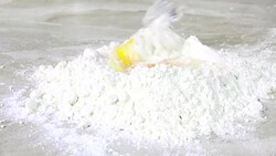 Mixing dough on a countertop Stock Footage