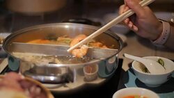 Enjoying a prawn from a Sukiyaki soup at Home. Slow Motion. Stock Footage
