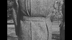 Men and women model the latest casual and luxurious coats and jacket outdoors News Clip