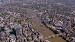 Aerial View of The Shard, Tower Bridge and Canary Wharf, London, UK. 4K Stock Footage