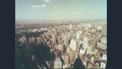 1960s: Aerial view of large city with skyscrapers Stock Footage