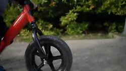 Toddler riding balance bike. Stock Footage