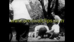 OLDER WOMAN AND YOUNG MAN WEARING REINDEER SWEATER SPEAK Stock Footage