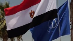 Egyptian flag fluttering in wind and welcome sign News Clip
