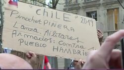 CLEAN : Protesters in Paris gather outside Chilean embassy News Clip